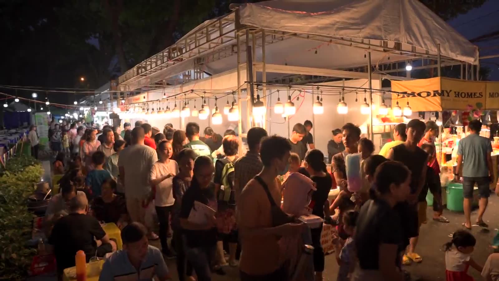 Night market with lanterns and local visitors